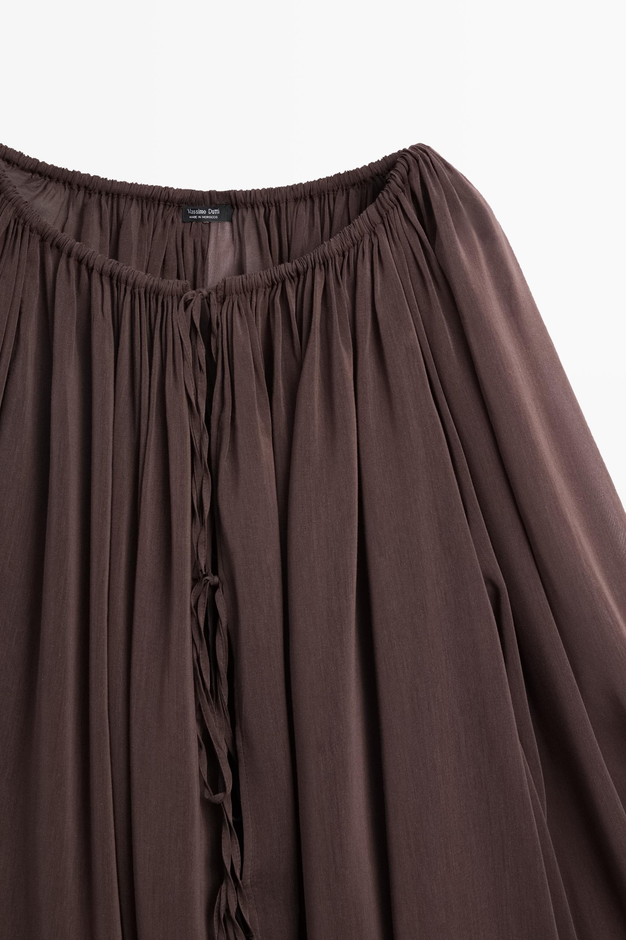 Flowing shirt with gathered details